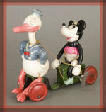 DONALD DUCK AND MINNIE MOUSE RARE CELLULOID WIND-UP TOY.