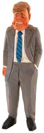 JFK HAND-CARVED AND PAINTED EARLY 1960S WOOD FIGURE.