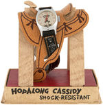"HOPALONG CASSIDY WRIST WATCH" ON SADDLE IN DISPLAY BOX.