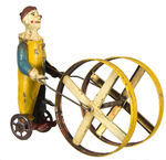 GERMAN PAINTED TIN CLOWN WIND-UP TOY.