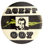 “AGENT 007” BUTTON PICTURING JAMES BOND OVER STYLIZED BODY OF WOMAN IN GOLD.