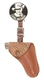 "TIM McCOY" BUTTON WITH MINIATURE HOLSTER AND SINGLE SHOT CAST IRON PISTOL.