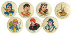 SEVEN BUTTONS FROM THE 1946 CAPTAIN MARVEL AND RELATED CHARACTERS SET.