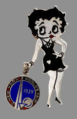BETTY BOOP ENAMEL AND SILVERED BRASS PIN WITH 1939 WORLD'S FAIR CHARM.