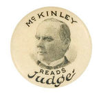 "McKINLEY READS JUDGE" RARE 1896 MAGAZINE ADVERTISING LAPEL STUD.
