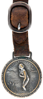 "SEPTEMBER MORN" 1912 ONCE SCANDALOUS PAINTING ON A SILVERED BRASS LIQUOR WATCH FOB.