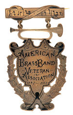 "AMERICAN BRASS BAND" 1887 HISTORIC 50TH ANNIVERSARY MEMBER'S ENGRAVED BADGE.