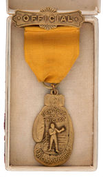 OFFICIAL’S RIBBON BADGE AND LAPEL STUD FOR 1937 GOLDEN GLOVES TOURNAMENT.