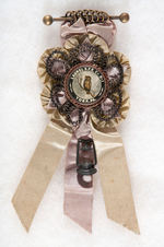 LAUREL FIRE COMPANY LARGE AND ORNATE RIBBON BADGE WITH CELLULOID.