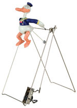 "DONALD DUCK ON TRAPEZE" WIND-UP WITH RARE BOX.