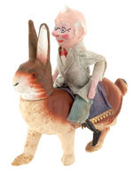 FOXY GRANDPA RIDING RABBIT EARLY CANDY CONTAINER.