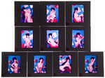 MAIL ORDER GROUP OF 12 PIN-UP SLIDES WITH RECORD THEMES.