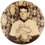 MAN IN "SPALDING" SHIRT HOLDING SOFTBALL REAL PHOTO BUTTON C. 1900.