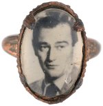 JOHN WAYNE C. 1939 "JAPAN" RING WITH REAL OVAL PHOTO UNDER PLASTIC DOME.