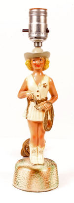 COWGIRL FIGURAL PAINTED CHALK LAMP.
