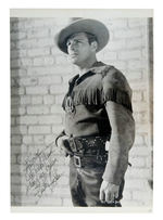 BUSTER CRABBE SIGNED PUBLICITY PHOTO.