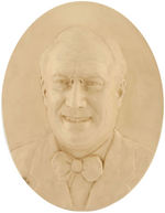 SMILING FDR HIGH RELIEF PORTRAIT ON OVAL PLASTER WALL PLAQUE.