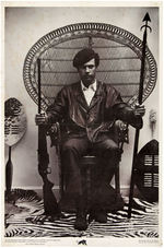 ICONIC BLACK PANTHER POSTER FEATURING IMAGE OF HUEY NEWTON WITH GUN AND SPEAR.