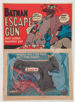 "BATMAN ESCAPE GUN" ON CARD.