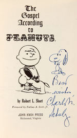 "THE GOSPEL ACCORDING TO PEANUTS" BOOK WITH SNOOPY SKETCH BY CHARLES M. SCHULZ.