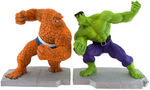 MARVEL BOOKENDS WITH THE HULK AND THING AND CAPTAIN AMERICA STATUE.