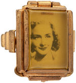 BRASS RING WITH HINGED LID OVER REAL PHOTO OF WOMAN.